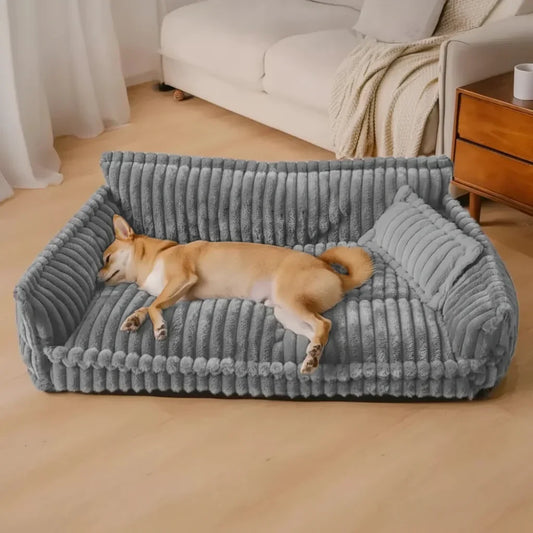 Cama tipo sofá lavable para perros con borde elevado